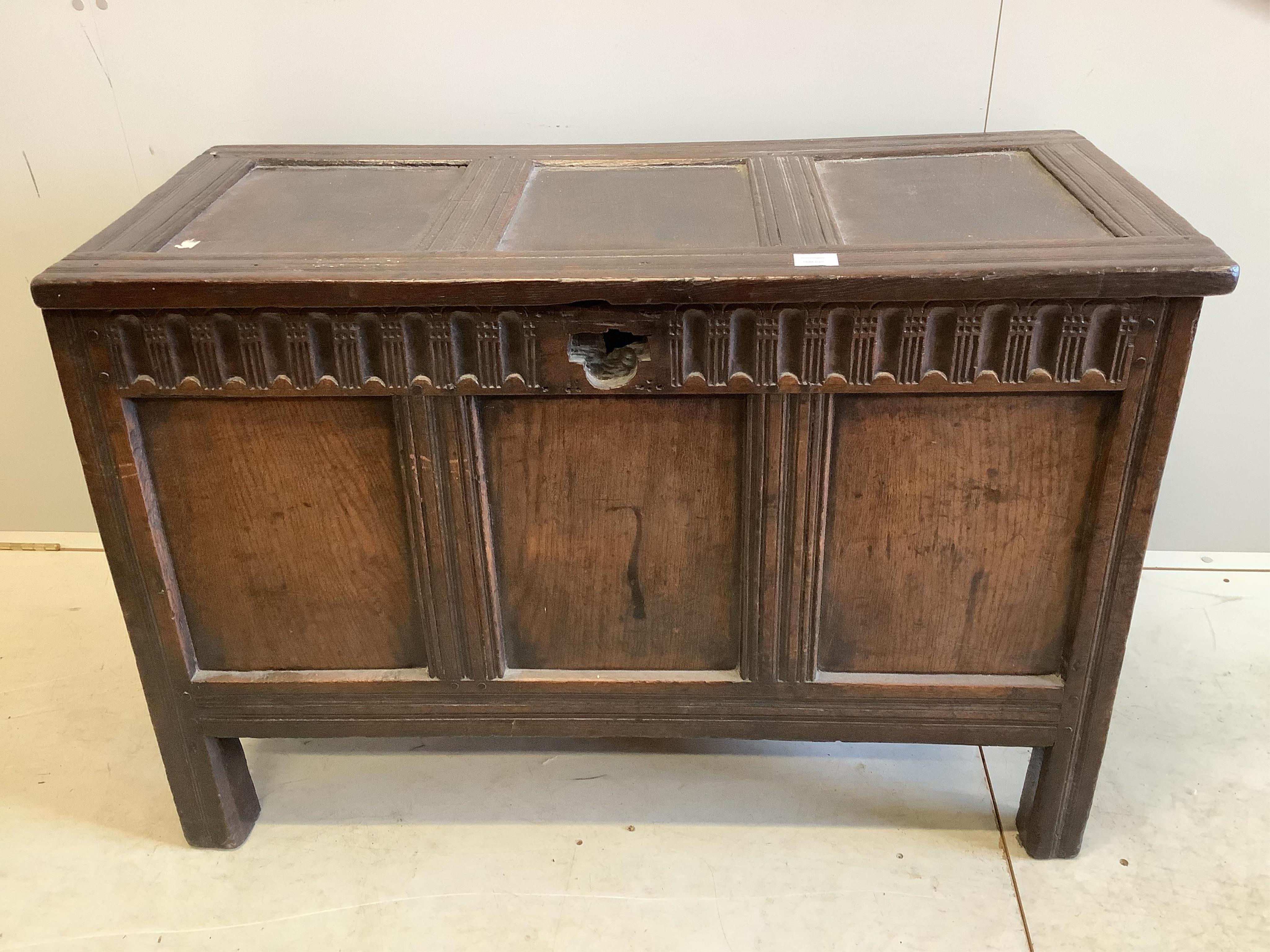 A 17th century panelled oak coffer, (damage to lock), width 111cm, depth 54cm, height 75cm. Condition - poor